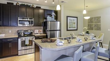 Chef-inspired kitchens with stainless steel appliances and granite countertops
